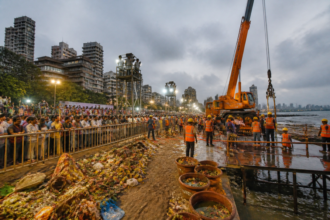 Ganeshotsav 2026 Mumbai immersion site with a crane, lighting and civic workers preparing the shoreline