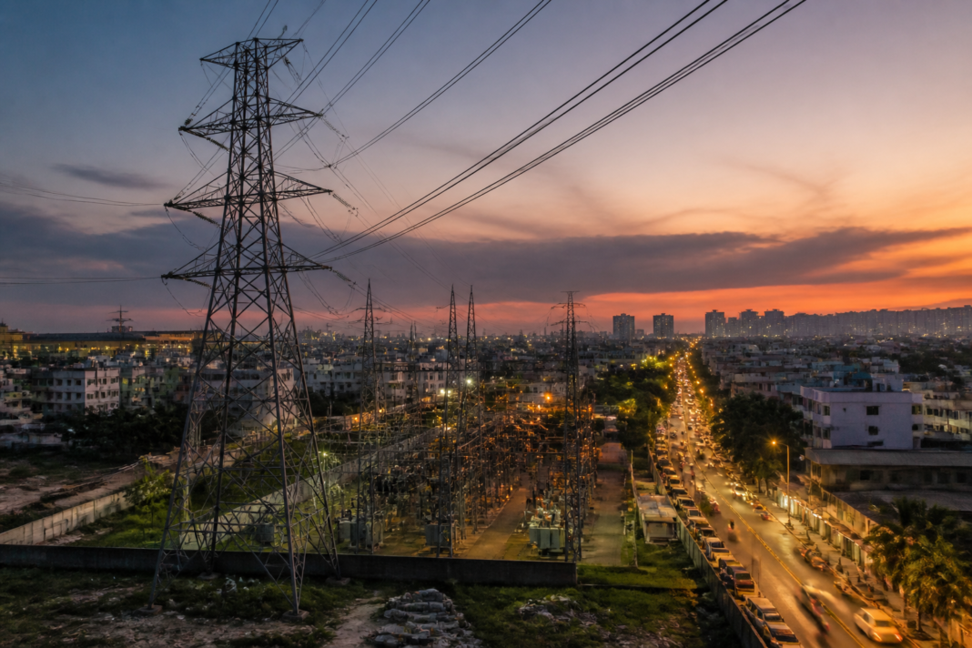 Tamil Nadu power supply infrastructure with transmission towers and urban electricity lines
