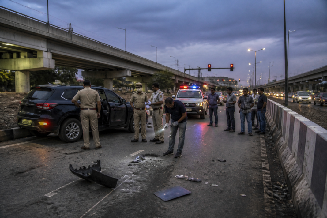 Faridabad road accident scene near Sikri flyover with a damaged SUV and police presence