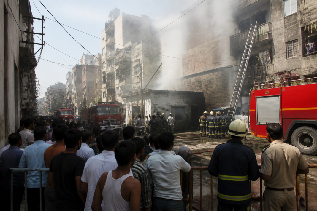 Delhi building fire in Swaroop Nagar as residents are rescued from an adjacent building