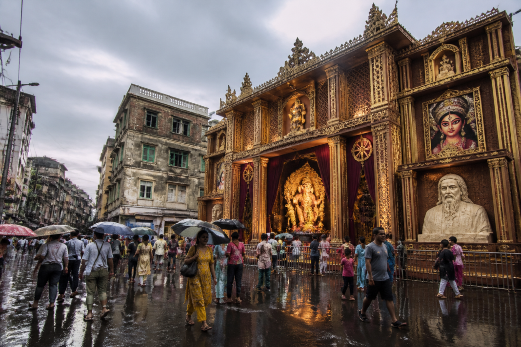 Kolkata Ganesh Puja pandal with Durga imagery and political-cultural displays