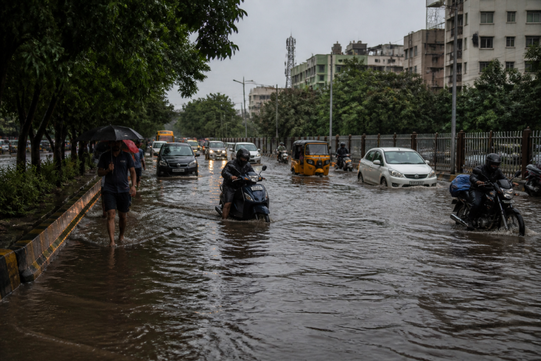 Hyderabad rain causing waterlogging on an urban road in a low-lying area
