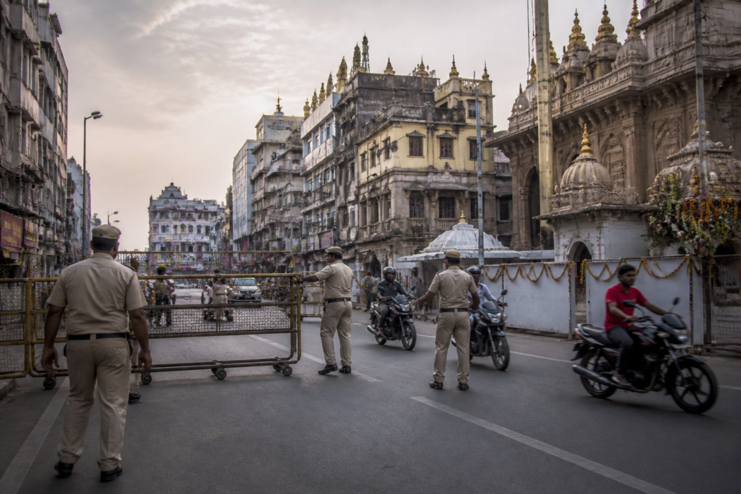 Pune traffic diversion signage and barricades on a central Pune road during an early-morning Ganpati event