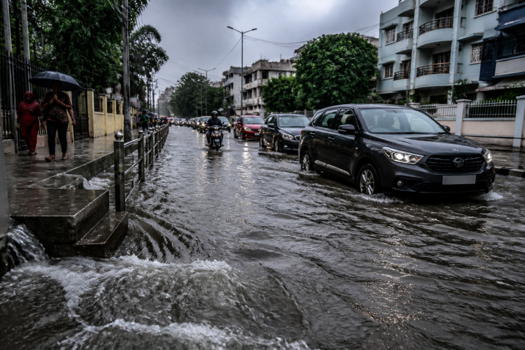 Hyderabad heavy rain causing waterlogging on a low-lying urban road