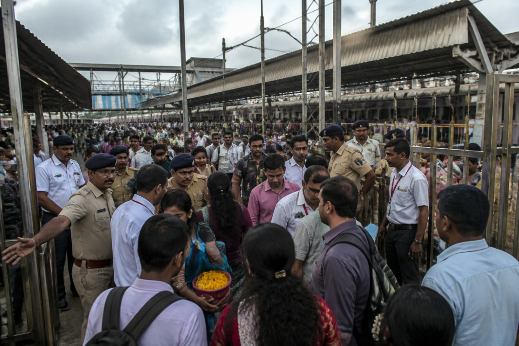 Ganeshotsav security personnel managing crowds at a Mumbai railway station