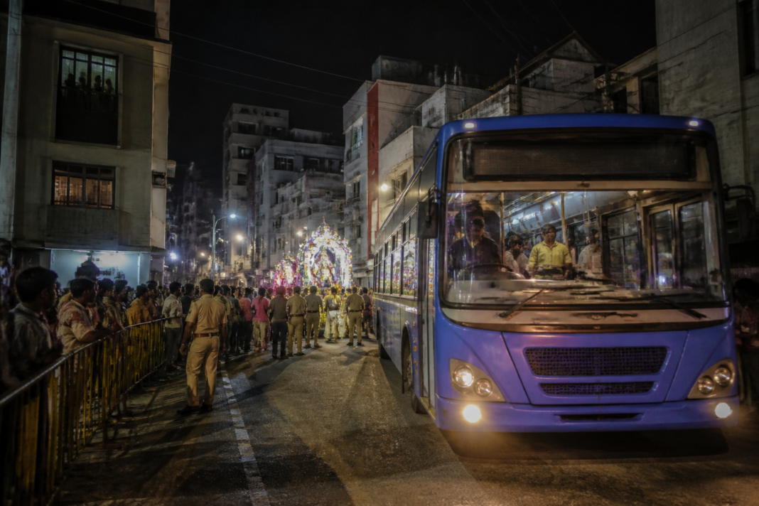 Chennai MTC bus near a Ramapuram street during a police-monitored procession