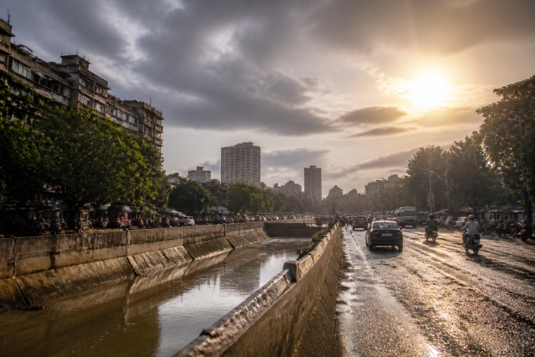 Maharashtra monsoon deficit reflected in dark rain clouds over an urban landscape