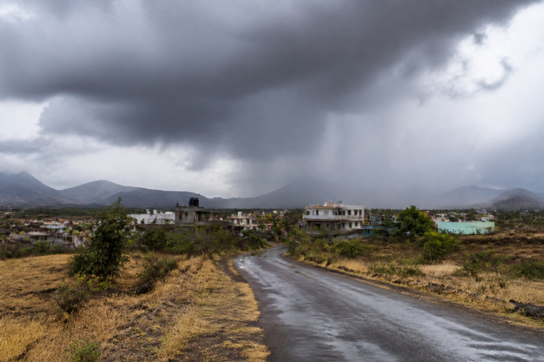 Maharashtra monsoon deficit reflected in rain clouds over a city and dry landscape