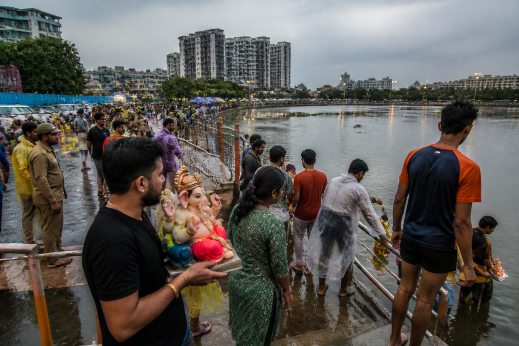 Vasai-Virar Ganpati immersion at a municipal artificial lake during light rain