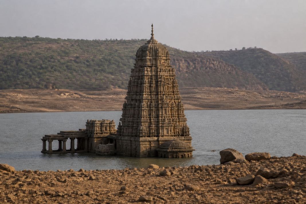 Sangameswara temple shikhara emerging from the Srisailam reservoir amid falling water levels