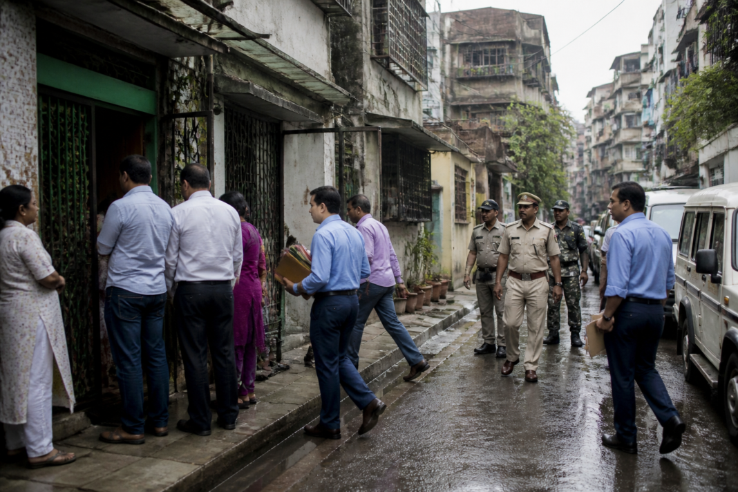 CID officers outside a Kolkata residence during the West Bengal land scam investigation