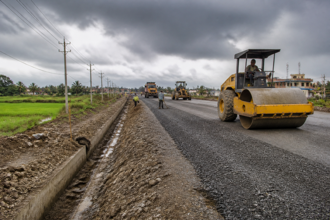 West Bengal road infrastructure work on a state highway with construction activity and drainage improvements