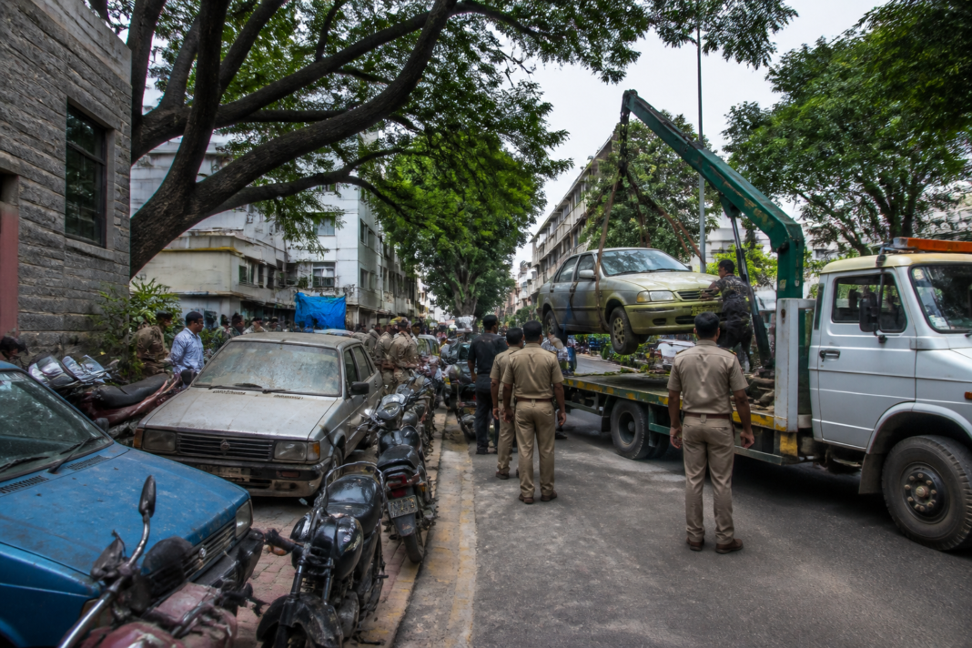 Bengaluru seized vehicles being shifted from a police station to an off-site government yard