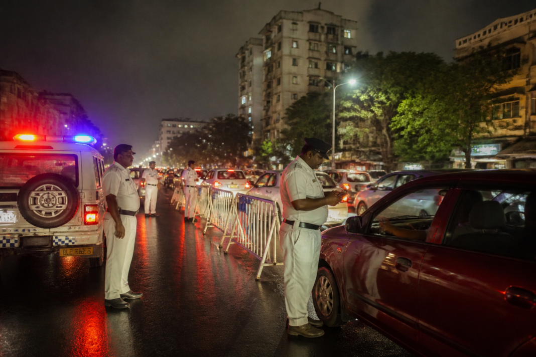 Kolkata drink-driving checks at a nighttime police naka on a city road