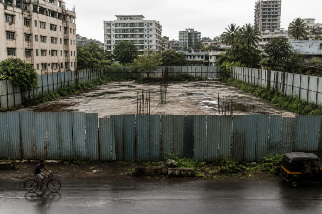 Mira-Bhayander construction permission dispute site enclosed by metal sheets in Navghar