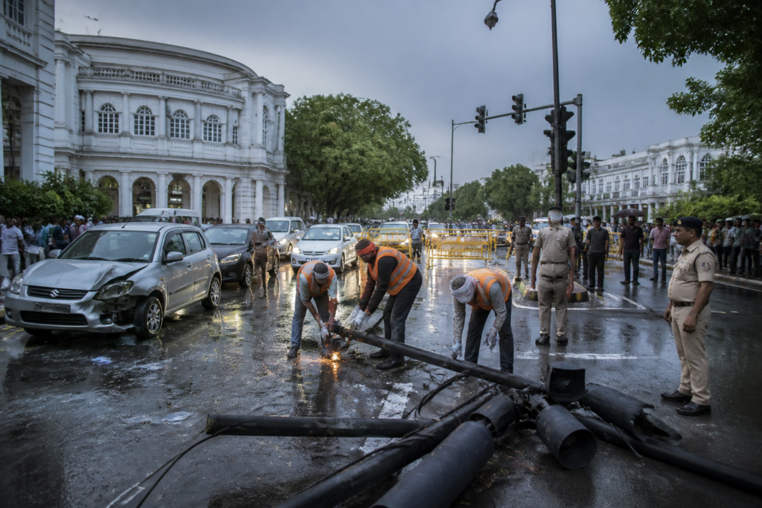 Delhi traffic signal pole collapse site near Minto Road in Connaught Place after the structure injured two people.