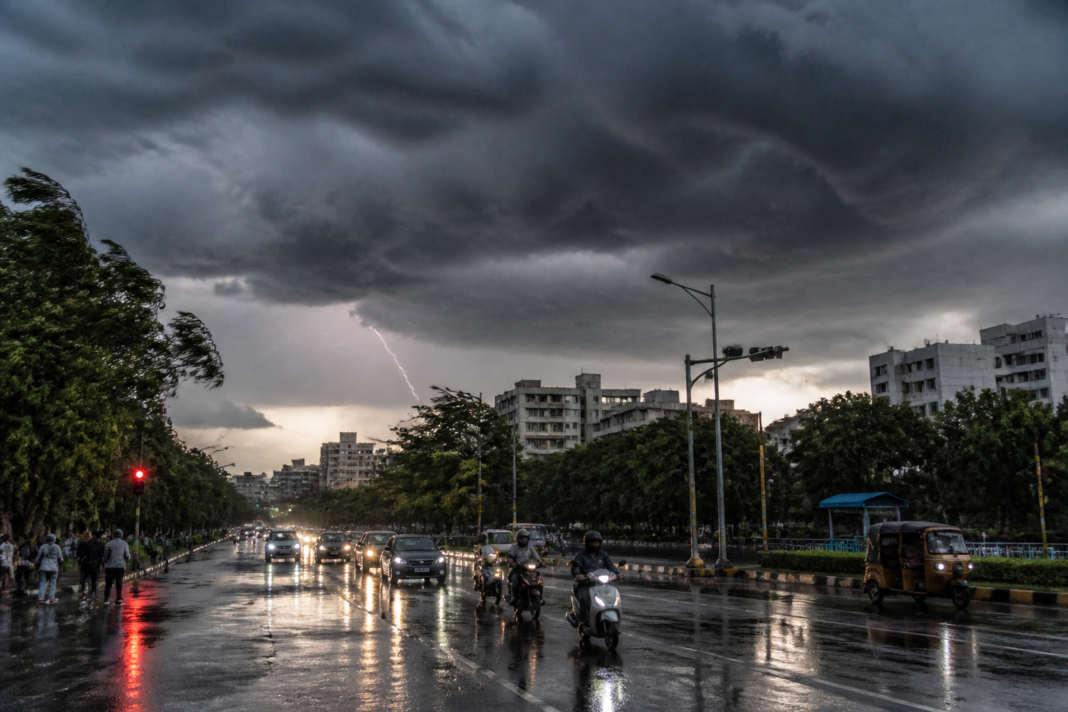 Telangana rainfall forecast with dark monsoon clouds over Hyderabad streets