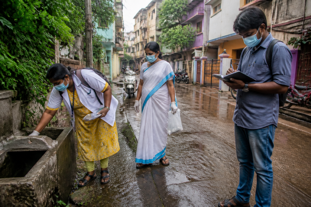 Tamil Nadu dengue prevention workers conducting mosquito-control operations in an urban neighbourhood