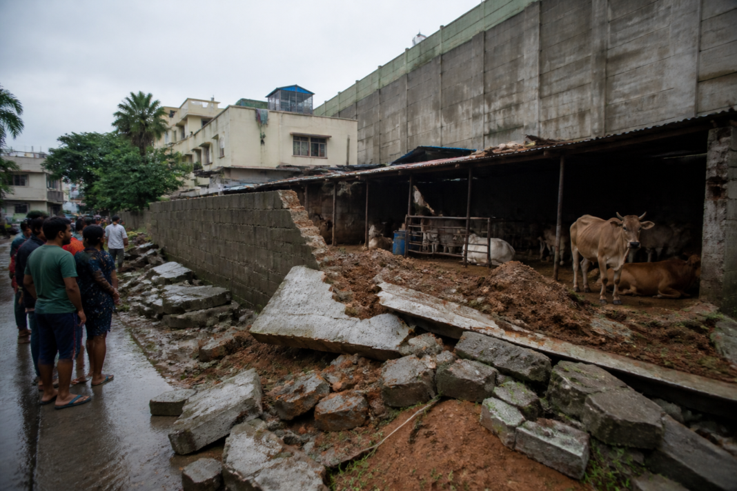 Damaged compound wall near Domlur cowsheds after the collapse
