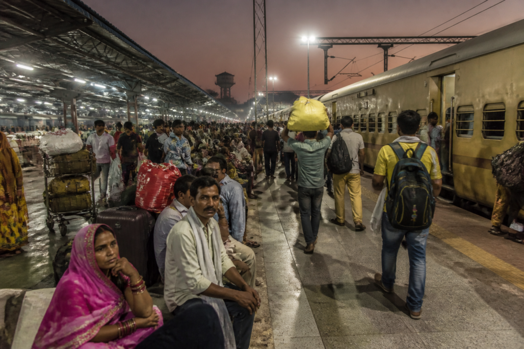 Diwali Chhath travel rush at a crowded Indian railway station with passengers and luggage