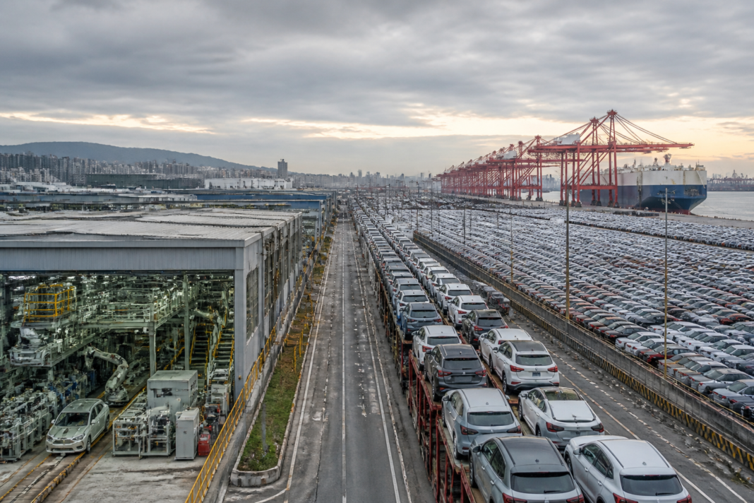 China car overcapacity represented by a crowded vehicle assembly plant and export port