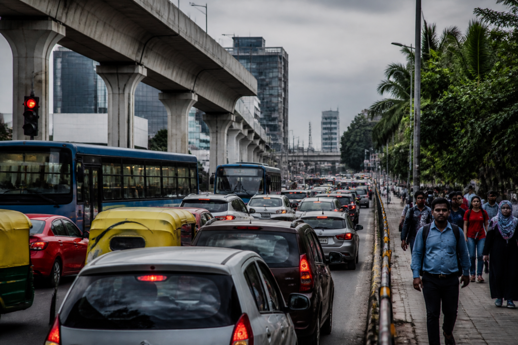 Bengaluru traffic on a congested urban corridor with flyovers and buses