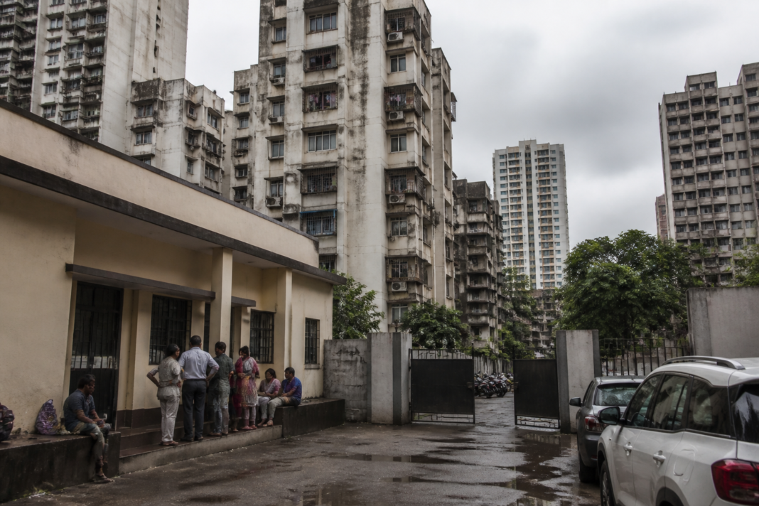 Mumbai tenant eviction cases represented by a residential building and a police administrative office.