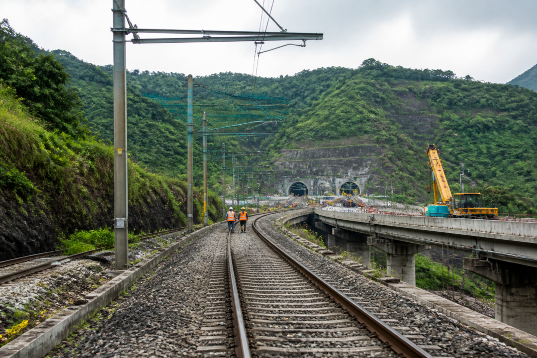 Panvel-Karjat local train corridor with tracks, bridges and hilly terrain in Maharashtra