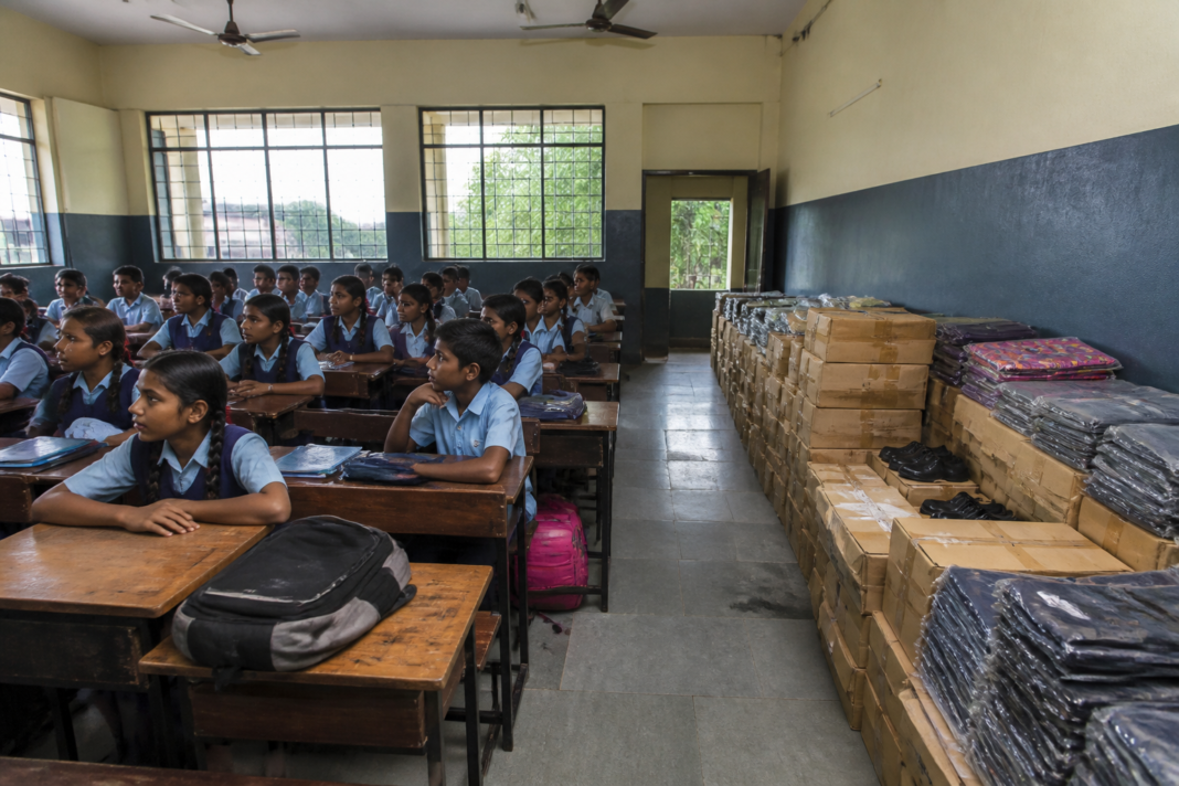 PCMC school students waiting for delayed educational supplies in a municipal school.