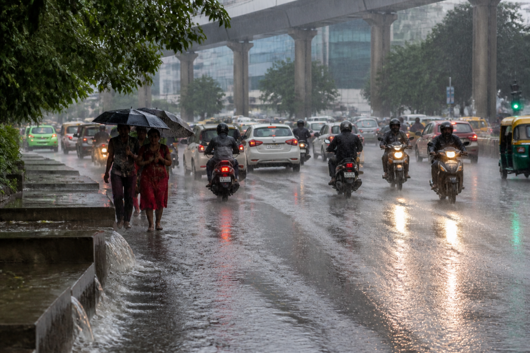 Karnataka rainfall over a wet Bengaluru road during a heavy monsoon shower