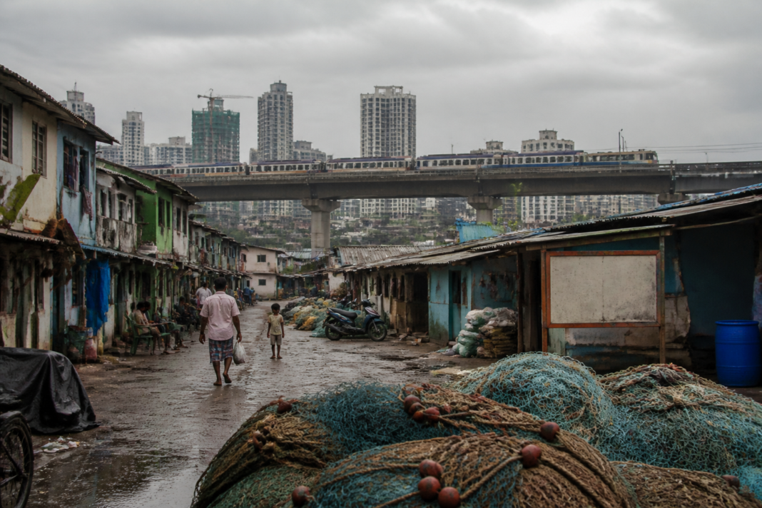 Dharavi Koliwada lanes and community homes beside Mumbai’s changing urban infrastructure