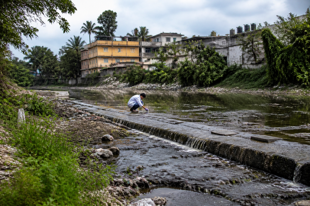 Cooum River pollution accumulating near a check dam in Chennai's urbanising outskirts