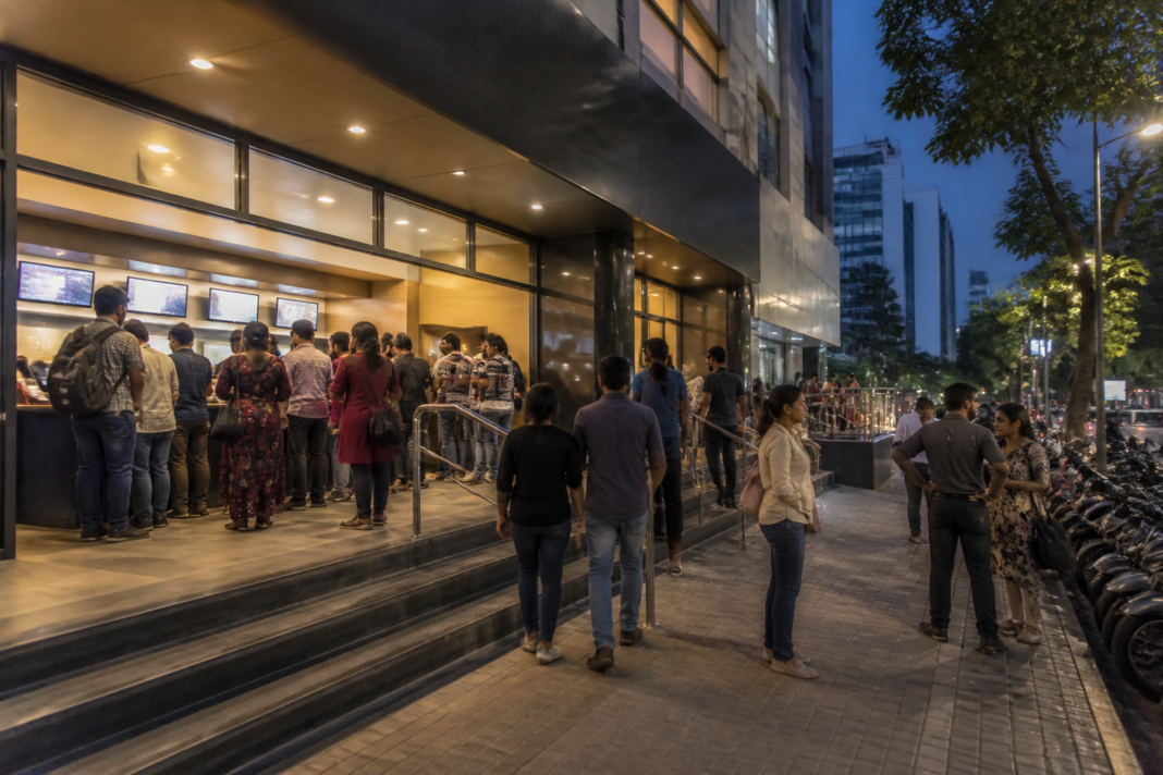 Karnataka cinema ticket cess debate at a Bengaluru multiplex entrance