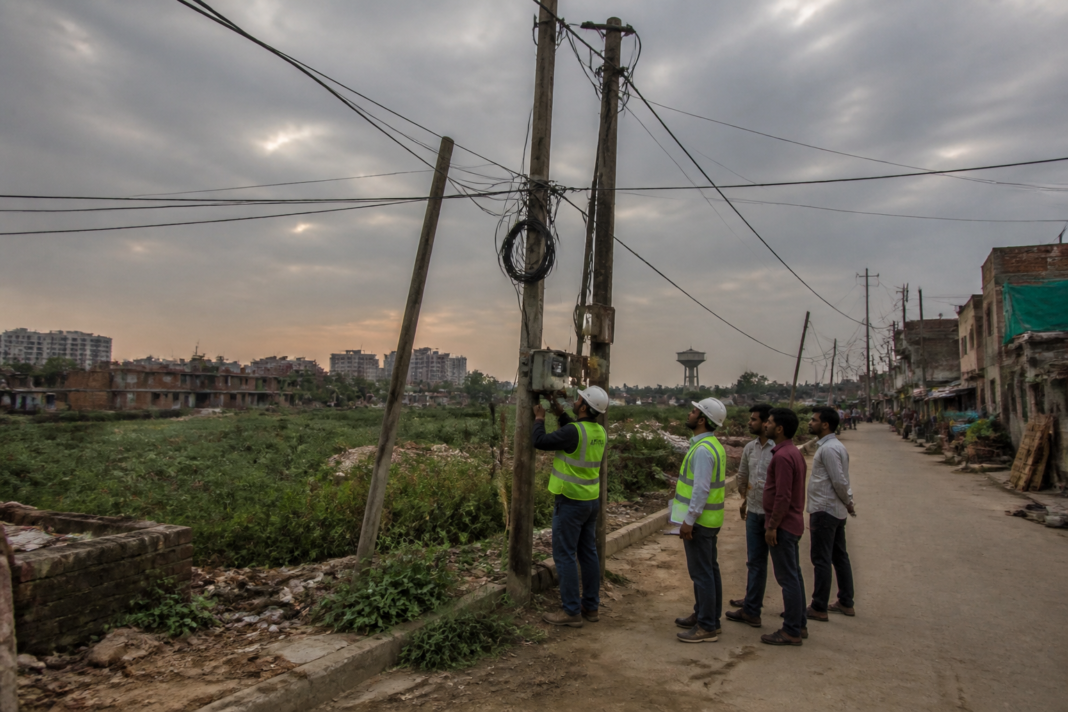 Noida electricity theft investigation near informal floodplain settlements and power lines