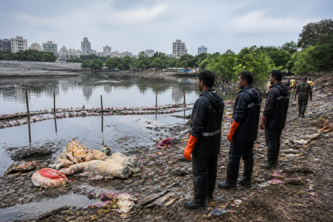 Thane Creek POP idol immersion site with idol remains visible near the muddy shoreline