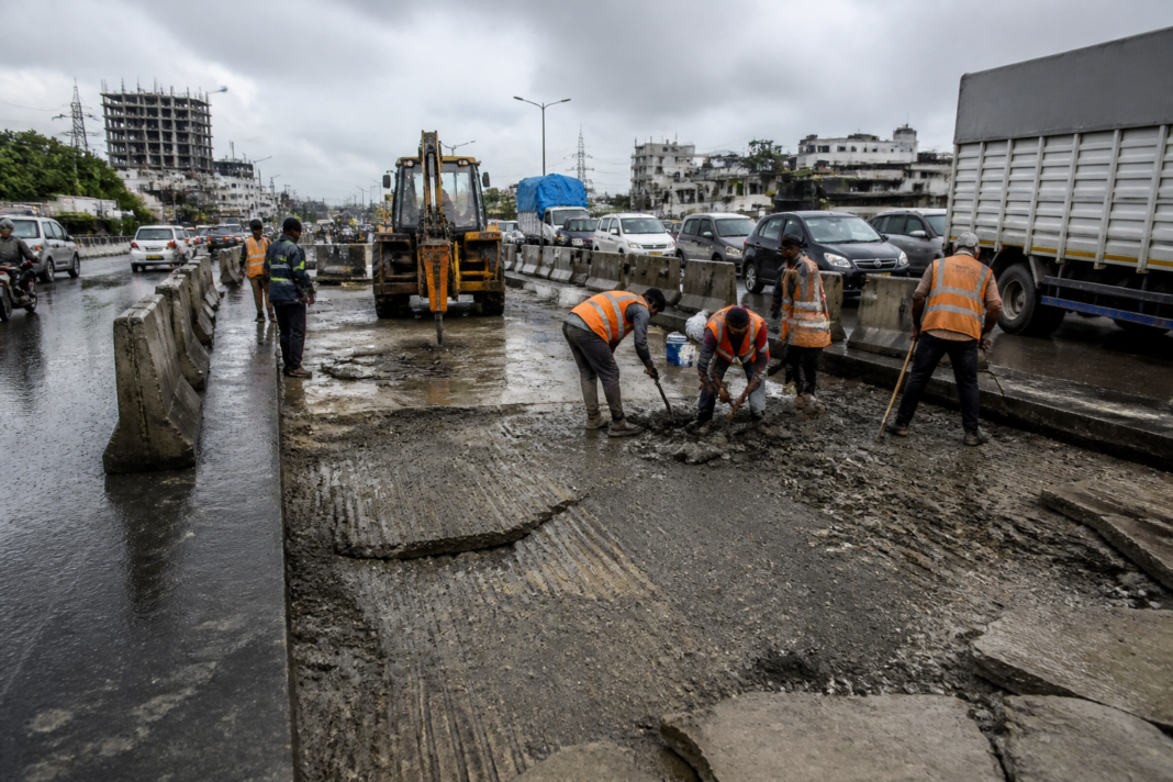 Mumbai-Ahmedabad Highway repair work on a damaged concrete road near Vasai
