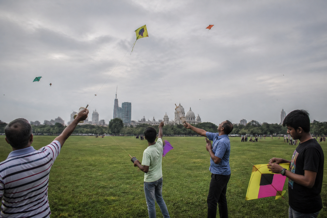 Kolkata kite festival participants flying kites across the Maidan public ground