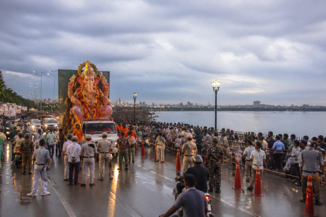 Hyderabad Ganesh idol immersions near Hussain Sagar with police banners restricting Tank Bund access.