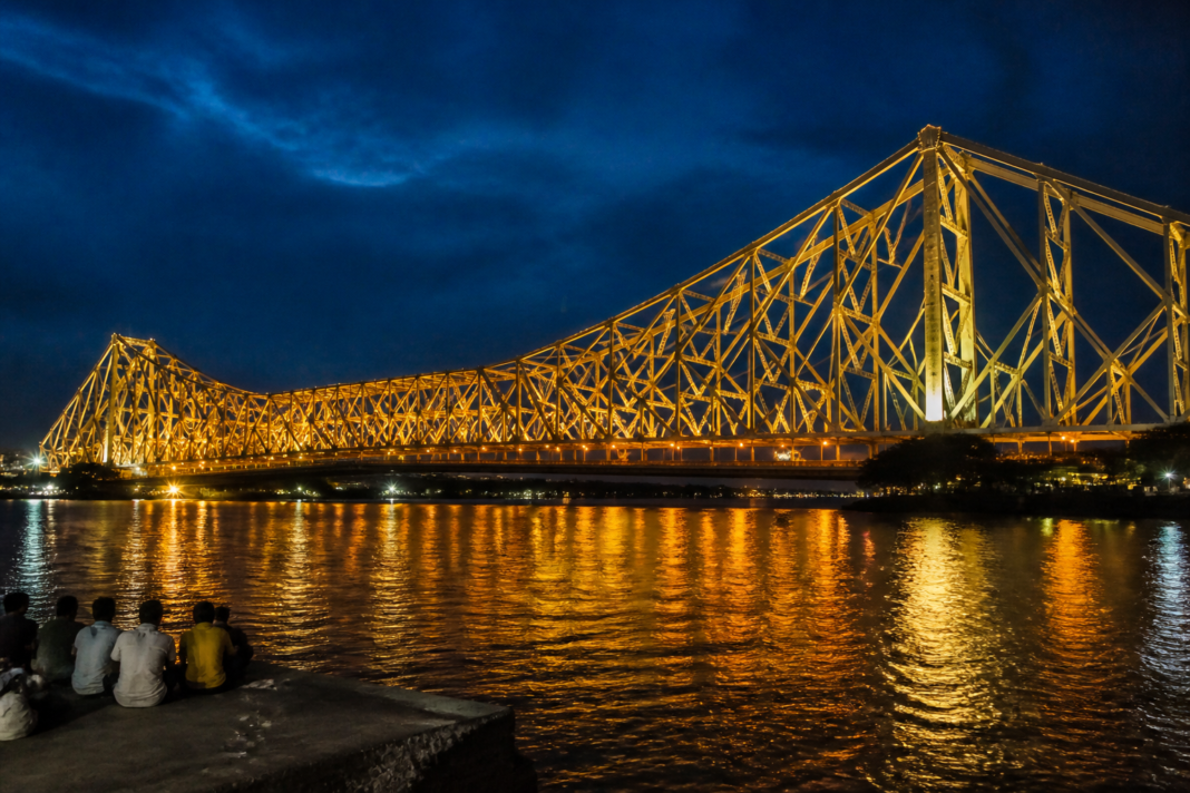 Howrah Bridge lighting illuminating Rabindra Setu over the Hooghly River in Kolkata