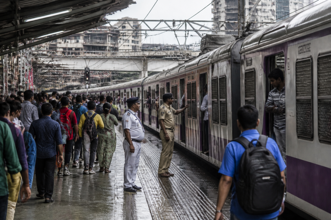 Mumbai local train at a suburban railway station during Ganeshotsav travel