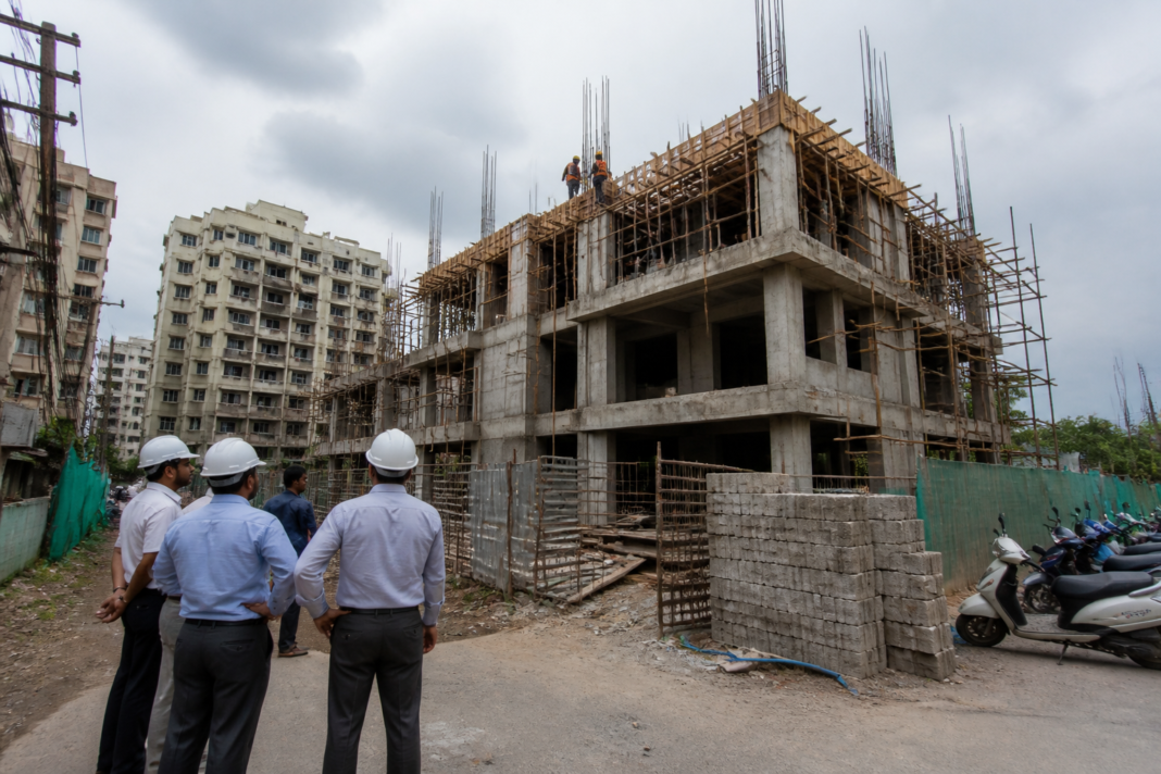 Vasai-Virar redevelopment project under municipal review with construction activity at a building site