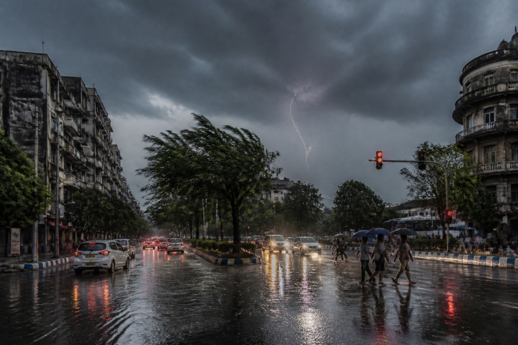 South Bengal rain alert showing lightning and heavy rain over a Kolkata street