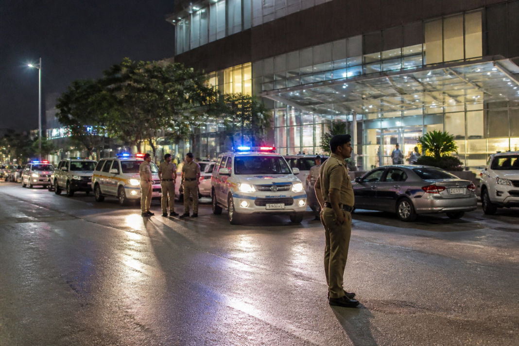 Gurugram spa raid at a commercial mall with police vehicles outside