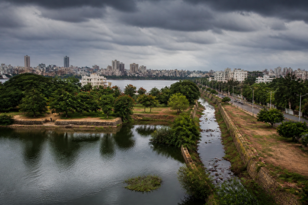 Bengaluru lakes linked by urban drainage channels amid expanding buildings and roads