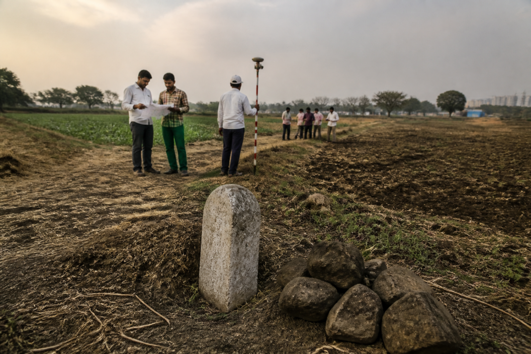 Telangana land dispute boundary area with survey markers and rural plots near Hyderabad