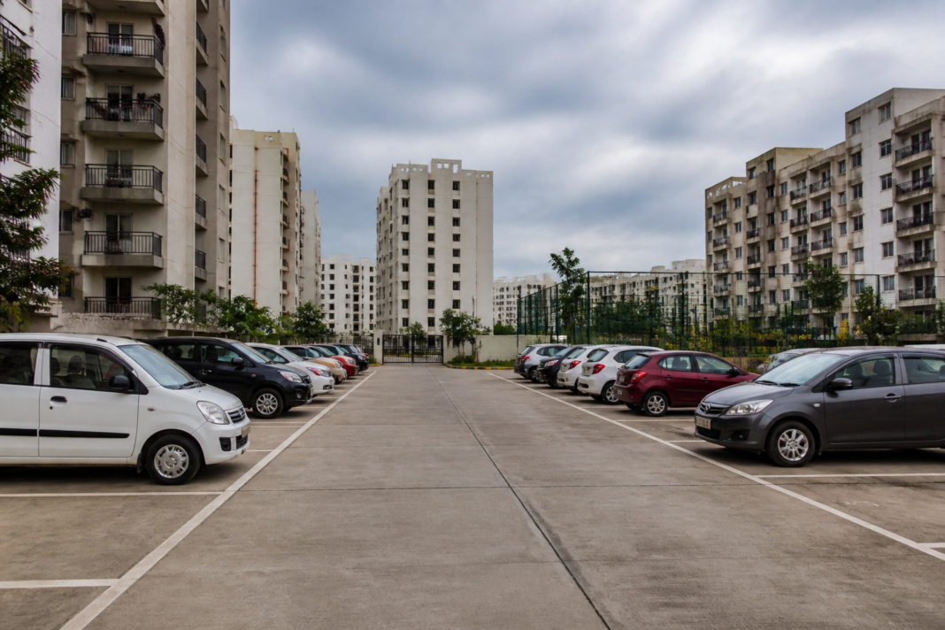 Parking rights housing society dispute in a residential complex with marked parking spaces