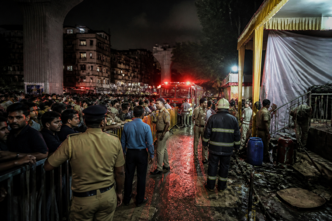 Mumbai Ganpati pandal entrance near Kalachowki crowded during the festival after an electrocution incident.