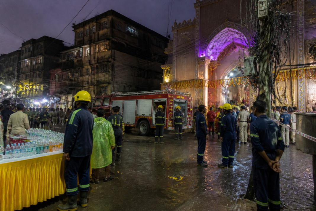 Mumbai Ganesh pandal entrance near a temporary stall after a fatal electrocution incident