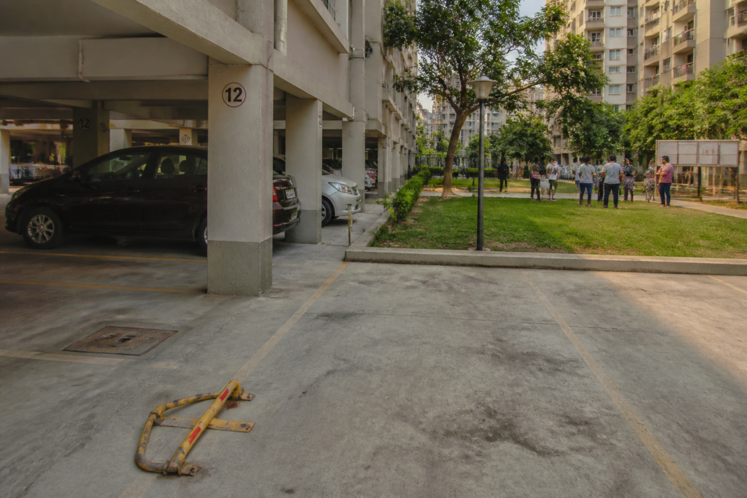Housing society parking dispute involving an allotted parking space in a Maharashtra residential complex
