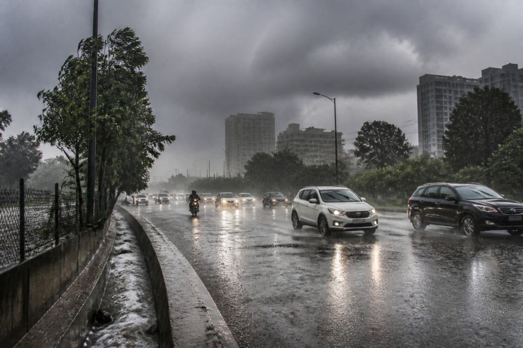 Telangana heavy rain over Hyderabad streets with dark clouds and intense monsoon showers